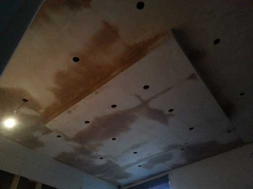A brand new protruded kitchen ceiling with new plaster and spot lights